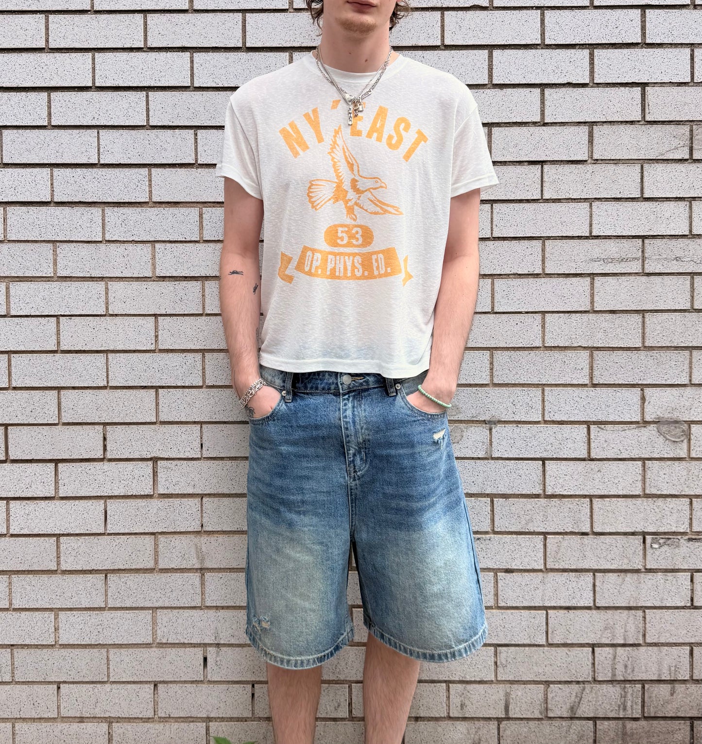 NY' East, tee